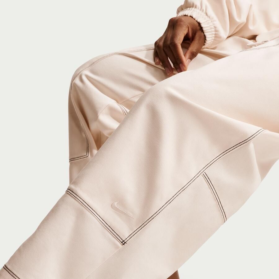 Nike ruimvallende werkbroek met lage taille voor dames Wit