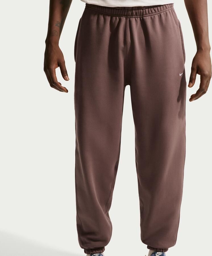 Nike Solo Swoosh fleecebroek met boorden voor heren Paars