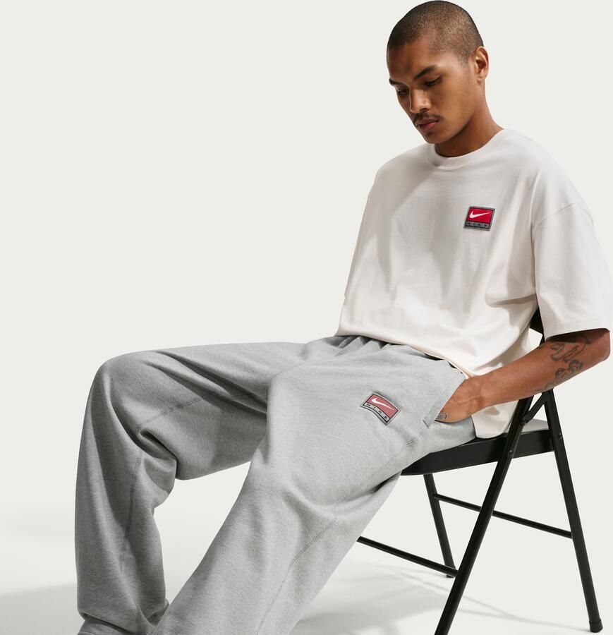 Nike Solo Swoosh fleecebroek met open zoom voor heren Grijs