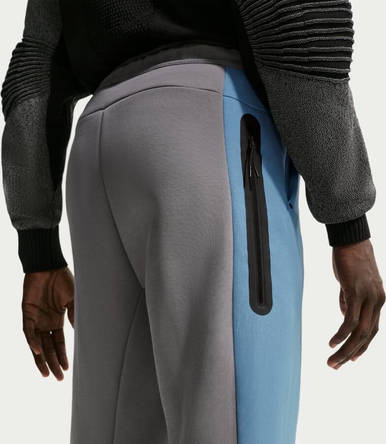 Nike Tech fleecebroek met kleurblokken en open zoom voor heren Zwart