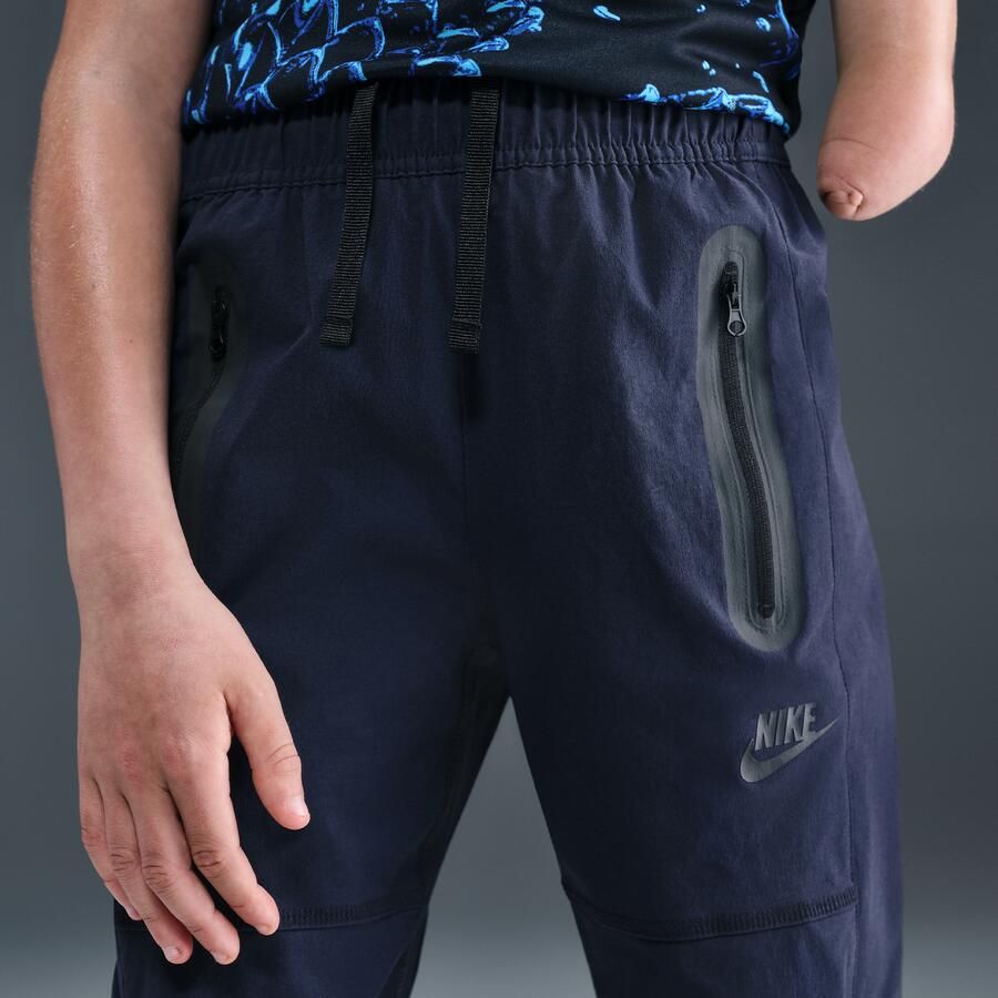 Nike Tech geweven jongensbroek Blauw