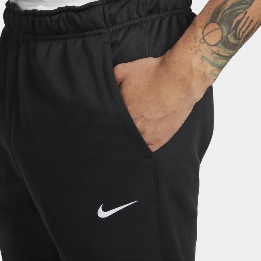 Nike Therma-FIT toelopende fitnessbroek voor heren Zwart