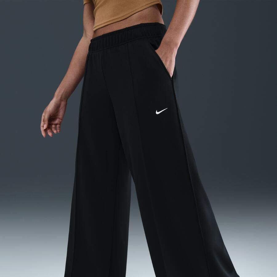 Nike trainingsbroek met wijde pijpen en halfhoge taille voor dames Zwart
