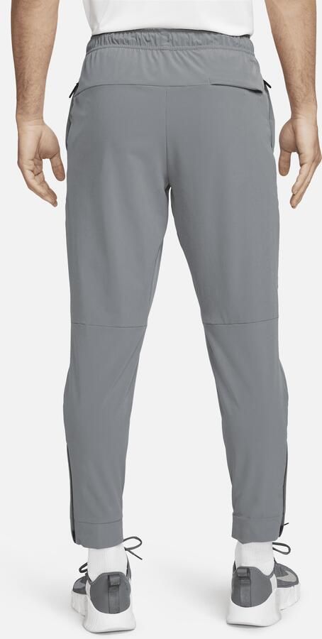 Nike Unlimited Dri-FIT veelzijdige herenbroek met ritsboord Grijs - Foto 4