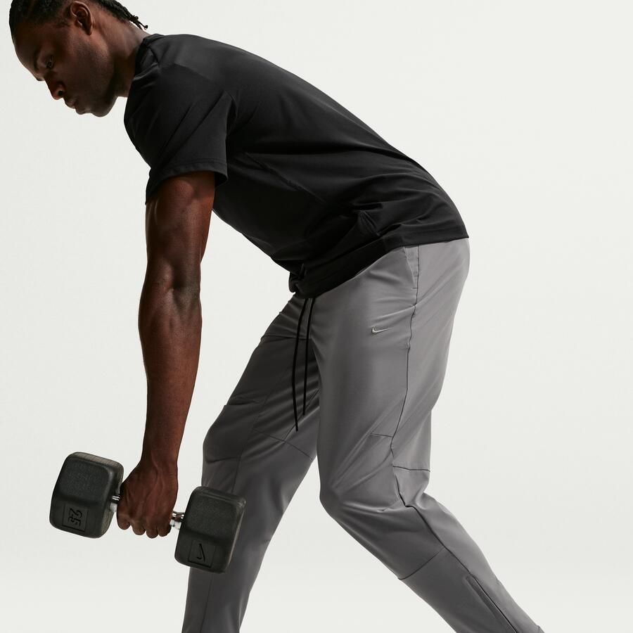 Nike Unlimited Dri-FIT veelzijdige herenbroek met ritsboord Grijs - Foto 4