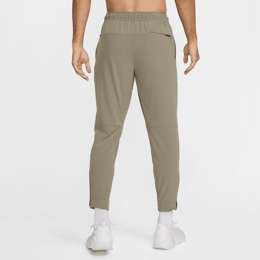 Nike Unlimited Dri-FIT veelzijdige herenbroek met ritsboord Groen
