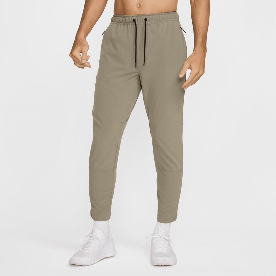 Nike Unlimited Dri-FIT veelzijdige herenbroek met ritsboord Groen - Foto 4