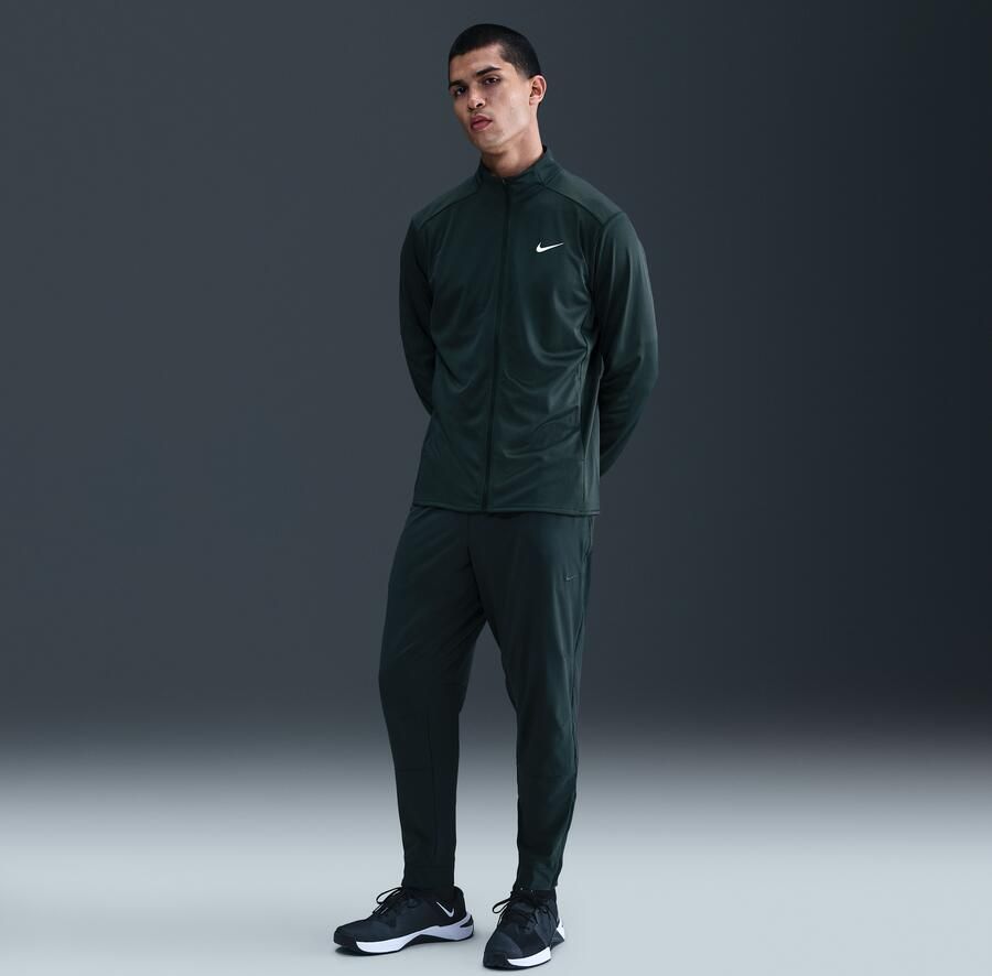 Nike Unlimited Dri-FIT veelzijdige herenbroek met ritsboord Groen