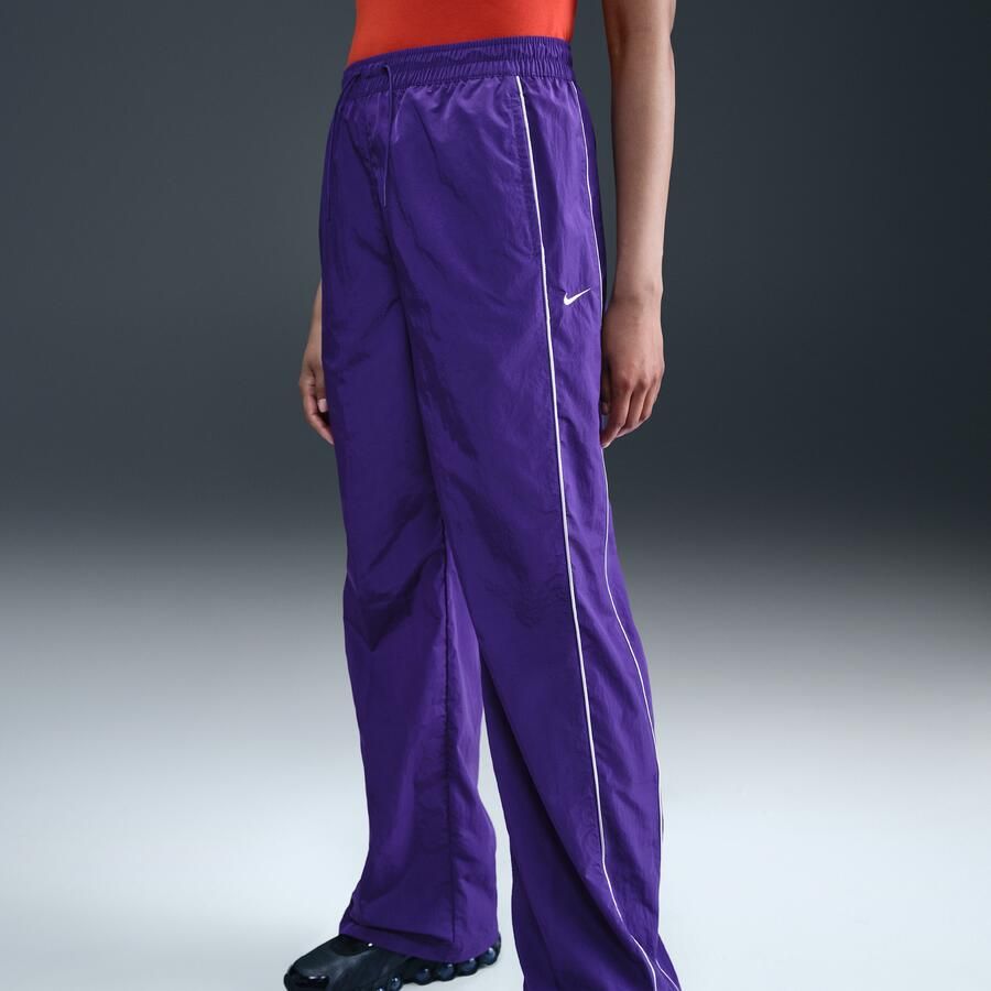 Nike Windrunner geweven damesbroek met hoge taille en open zomen Paars