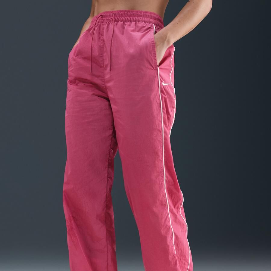 Nike Windrunner geweven damesbroek met hoge taille en open zomen Paars