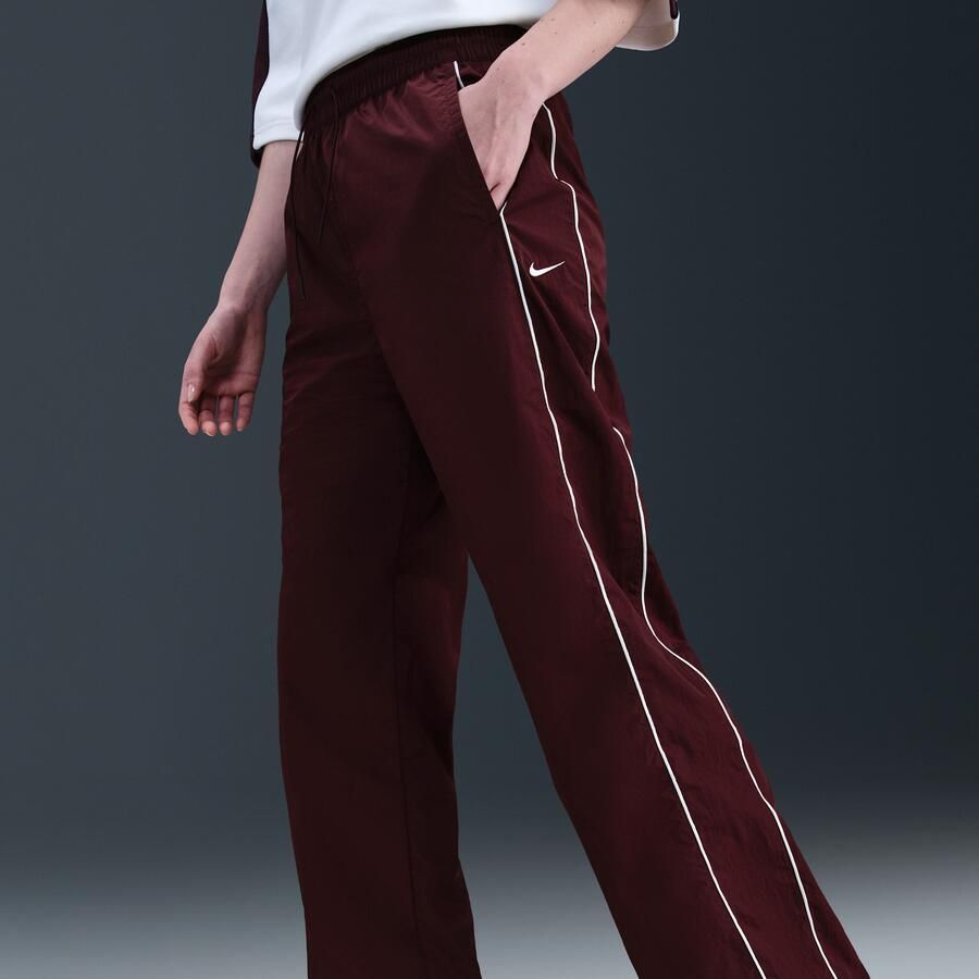 Nike Windrunner geweven damesbroek met hoge taille en open zomen Rood