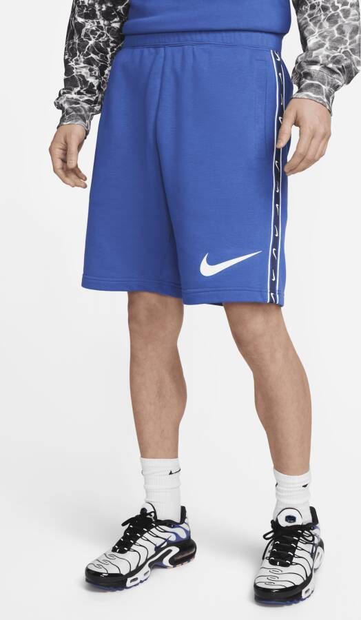 Nike Sportswear herenshorts van sweatstof met herhaald patroon Blauw