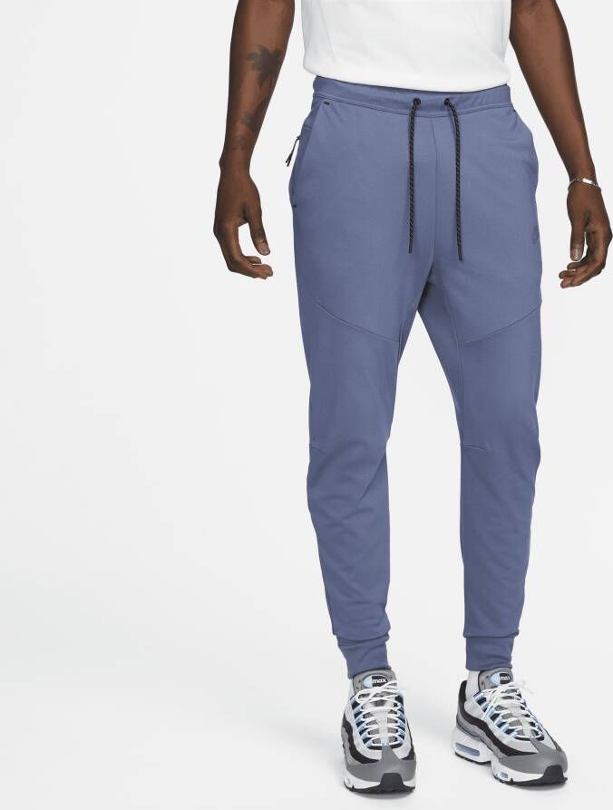 Nike Sportswear Tech Fleece Lightweight joggingbroek met aansluitende pasvorm voor heren Blauw