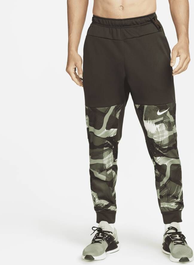 Nike Therma-FIT Trainingsbroek met taps toelopend design en camouflageprint voor heren Bruin