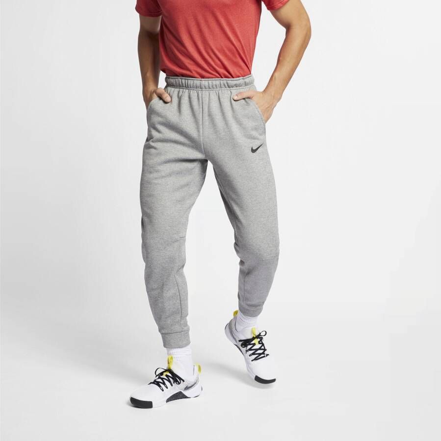 Nike Therma-FIT Trainingsbroek met taps toelopend design voor heren Grijs