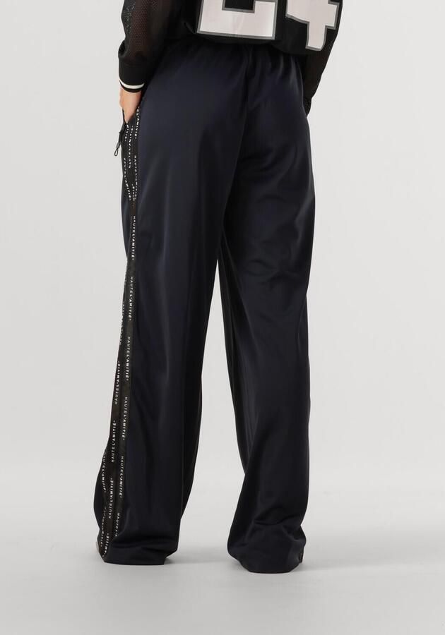 HAUTE L'AMITIÉ Haute L'Amitié Dames Broeken Logo Tape Track Tall Pant Donkerblauw