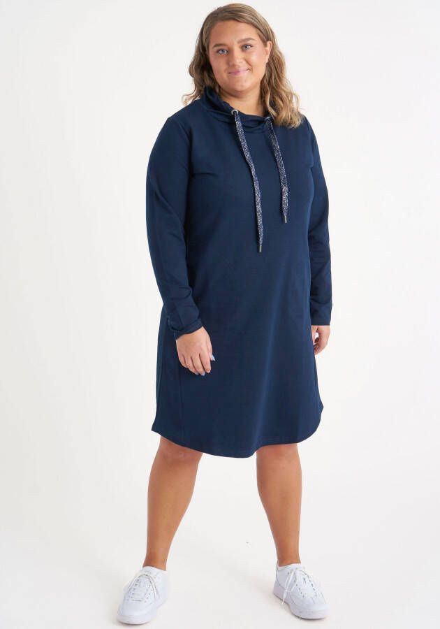 Aprico Sweatjurk Abrikooskleurige jurk