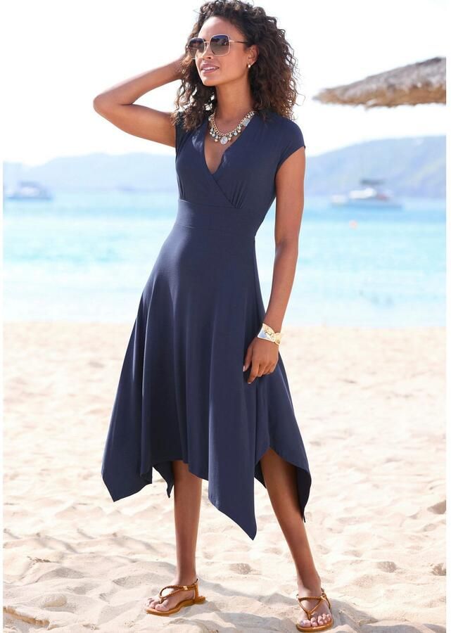Beachtime Zomerjurk met puntzoom en strik jersey jurk asymmetrisch rokdeel