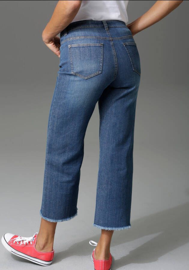 Aniston CASUAL 7 8 jeans met iets gerafelde voetzoom