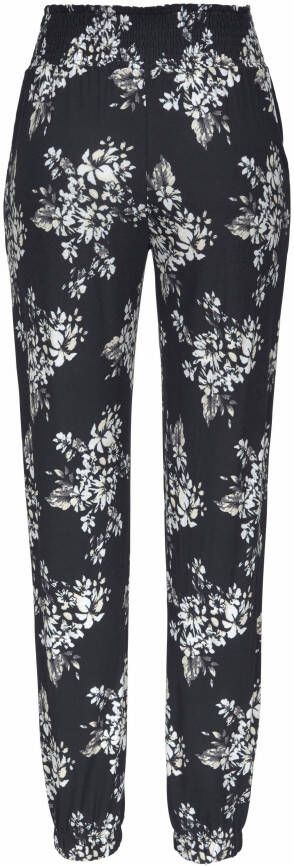 Lascana Strandbroek met subtiele bloemenprint soepelvallende jersey broek zomerbroek