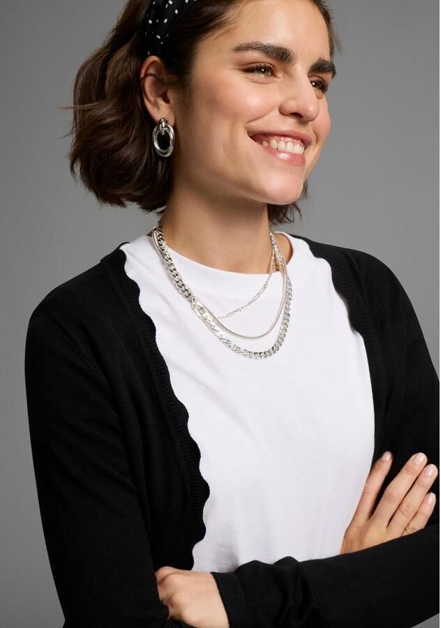 Laura Scott Vest Fijn breisel in lange vorm met vrouwelijke golvende rand