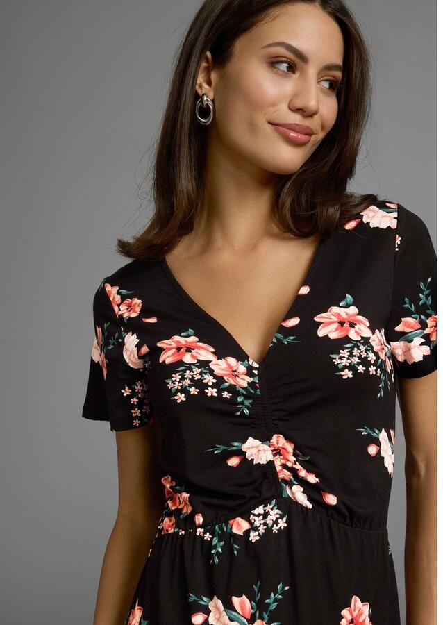 Laura Scott Zomerjurk met ro tische bloe print en rimpeling midijurk