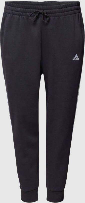Adidas Sportswear Plus SIZE sweatpants met labeltypische galonstrepen