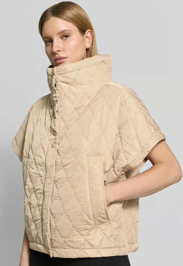 Cph Muse Cape met stiksels en steekzakken
