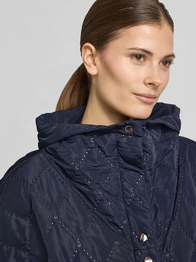 Cph Muse Cape met stiksels en steekzakken