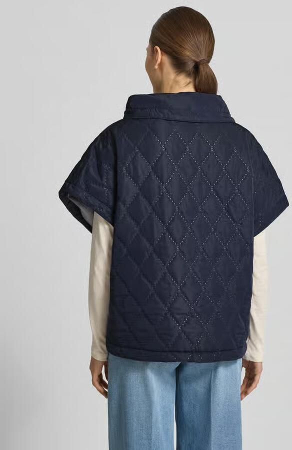 Cph Muse Cape met stiksels en steekzakken