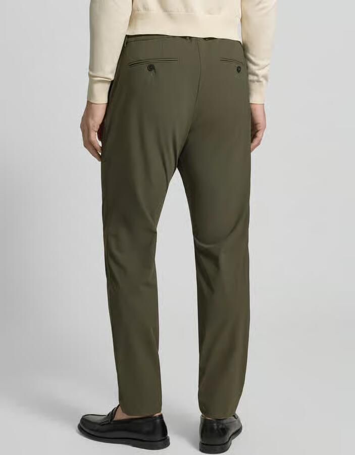 Cruna slim fit broek met paspelzakken op het zitvlak