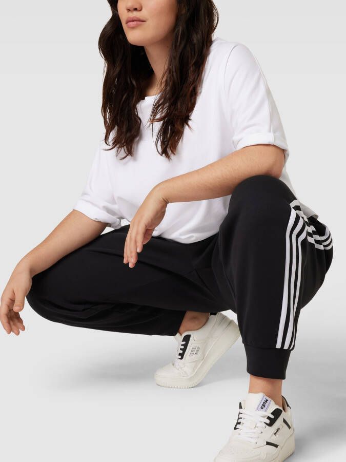 Adidas Sportswear Plus SIZE sweatpants met contraststrepen