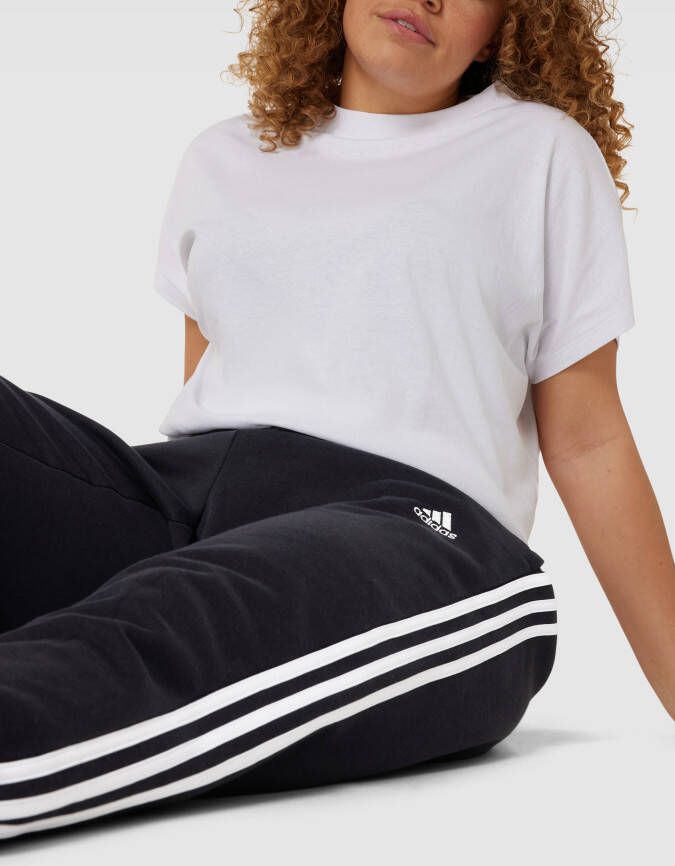 Adidas Sportswear Plus SIZE sweatpants met labeltypische galonstrepen