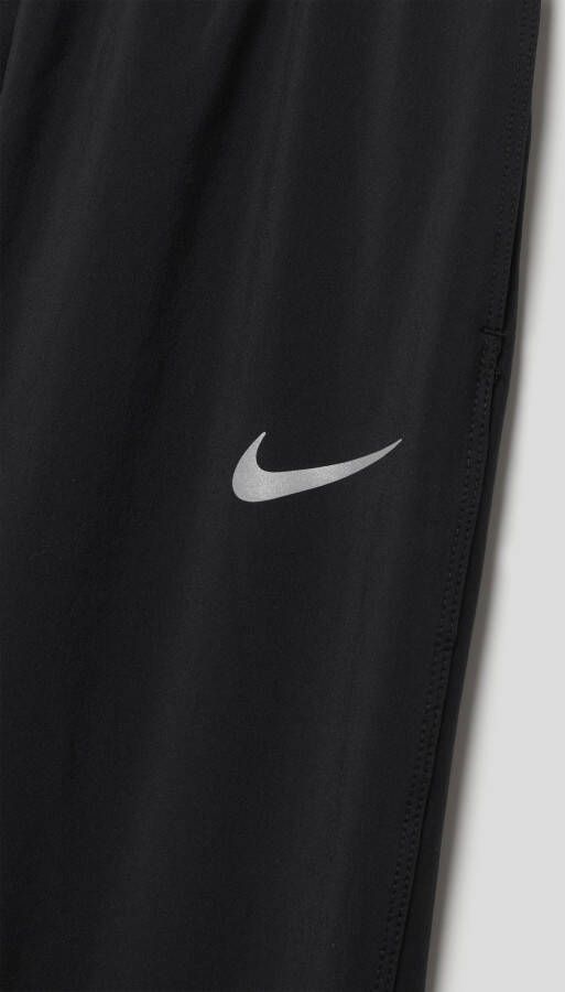 Nike Dri-FIT Geweven trainingsbroek voor jongens Zwart
