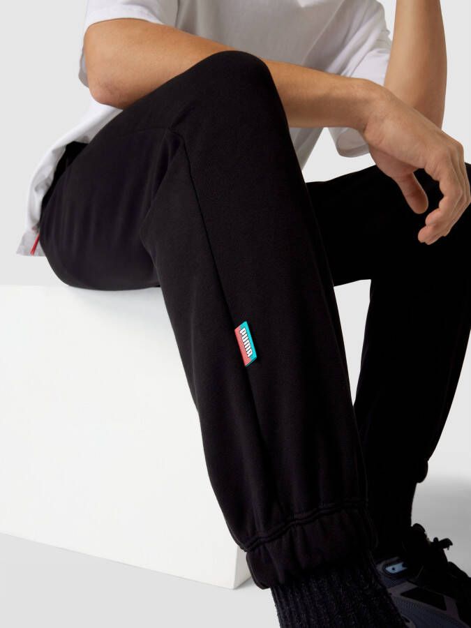 PUMA PERFORMANCE Sweatpants met labelapplicatie model 'Fandom'