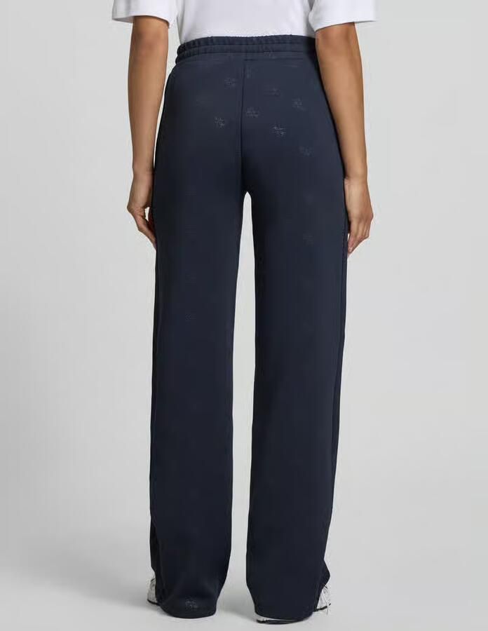GUESS Activewear Wide fit sweatpants met all-over logoprint model 'Calista'