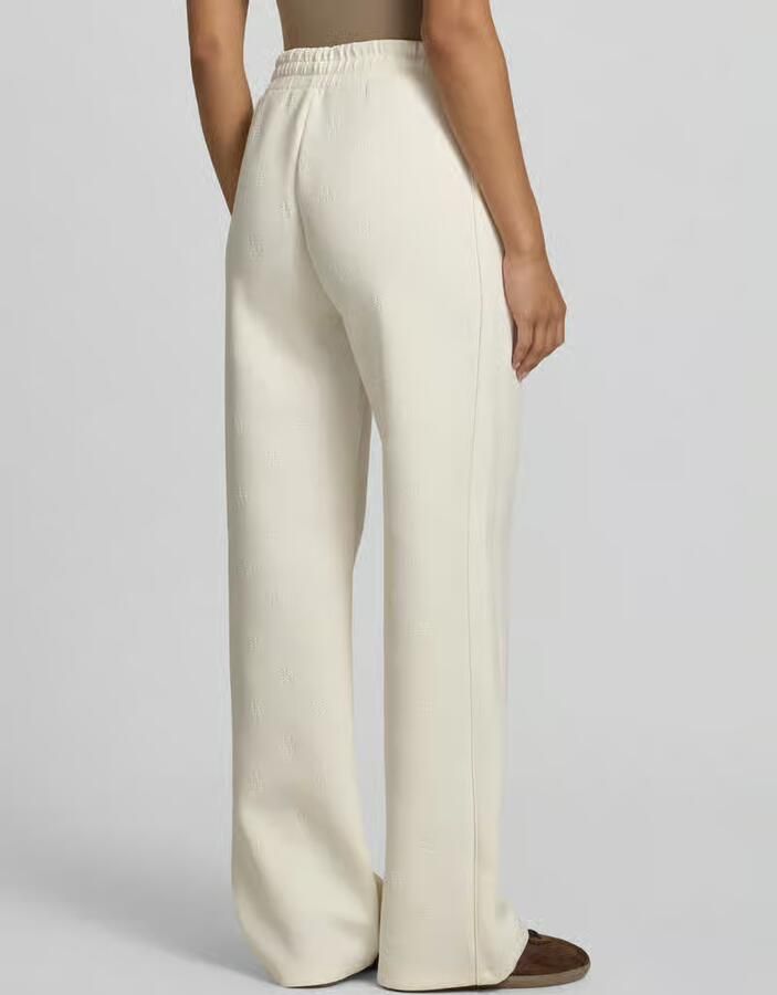 GUESS Activewear Wide fit sweatpants met all-over logoprint model 'Calista' - Foto 2