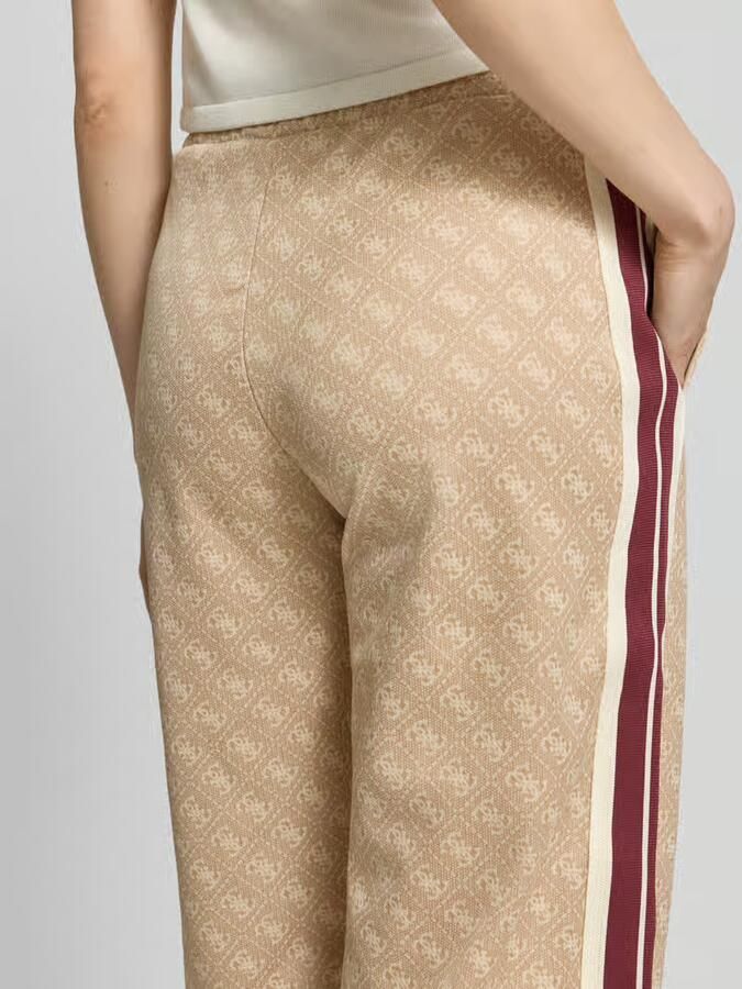 GUESS Activewear wide fit sweatpants met all-over logoprint model 'Jacquard'