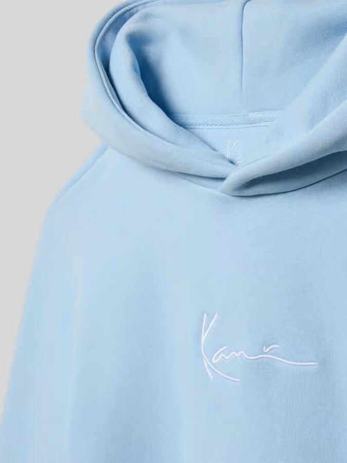 Karl Kani Regular fit hoodie van katoenmix met kangaroezak