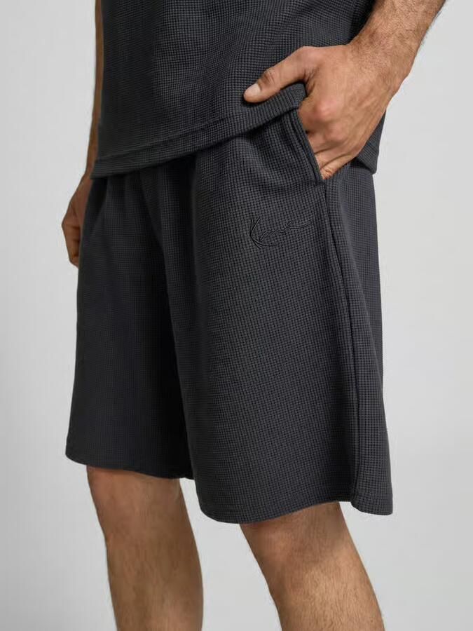 Karl Kani relaxed fit korte broek met structuurpatroon