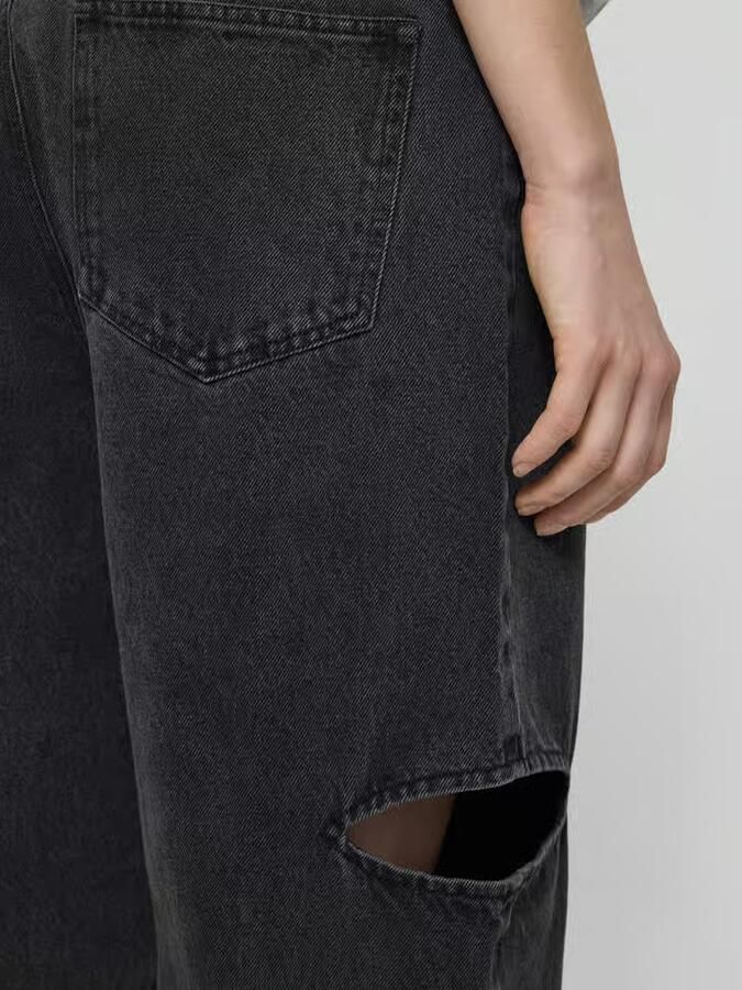 Karo Kauer Wide leg jeans met cut out