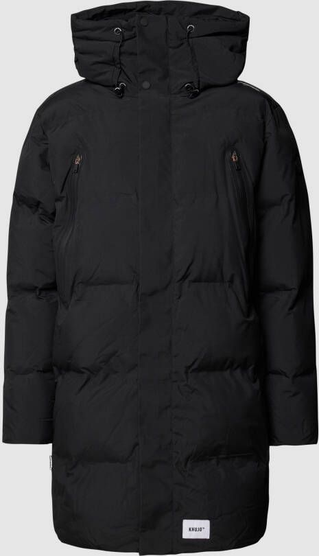 Khujo Lange jas met labeldetails