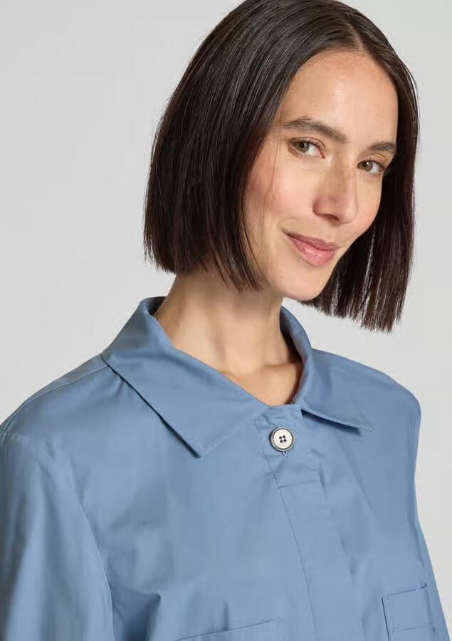 More Korte blouse met steekzakken