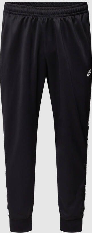 Nike PLUS SIZE trainingsbroek met logostrepen