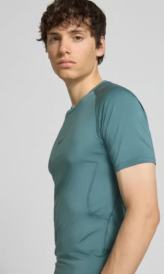 Nike Training T-shirt met logoprint en ronde hals