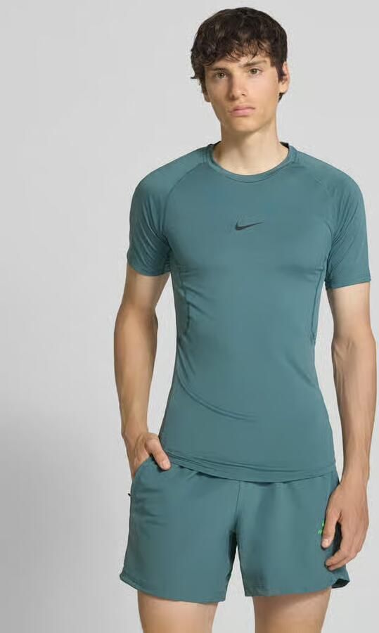 Nike Training T-shirt met logoprint en ronde hals - Foto 4