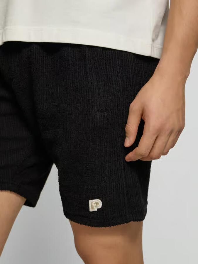 PEGADOR Short met labelpatch model 'LIBCO'