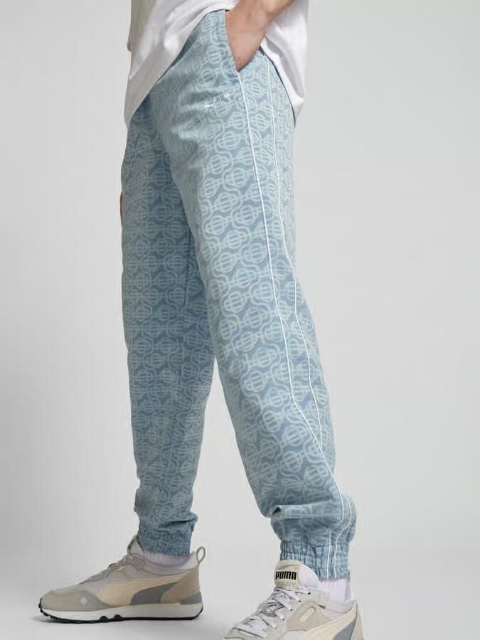 PUMA Performance Sweatpants met all-over motief