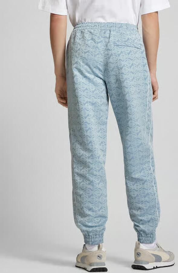 PUMA Performance Sweatpants met all-over motief