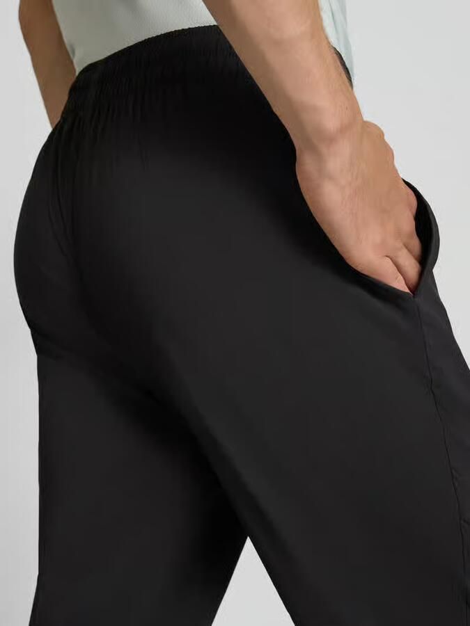 PUMA Performance tapered fit trainingsbroek met elastische band model 'TAD ESSENTIALS' - Foto 7